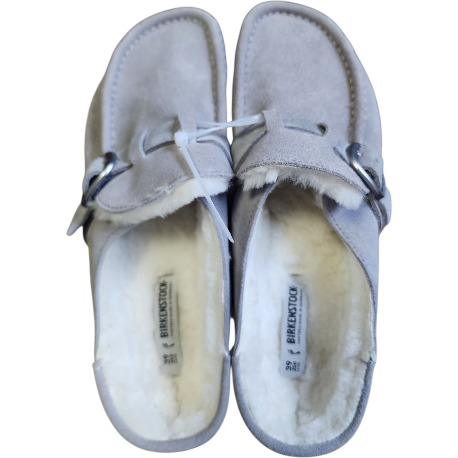 Pair of gray slippers with white fur lining on a white background