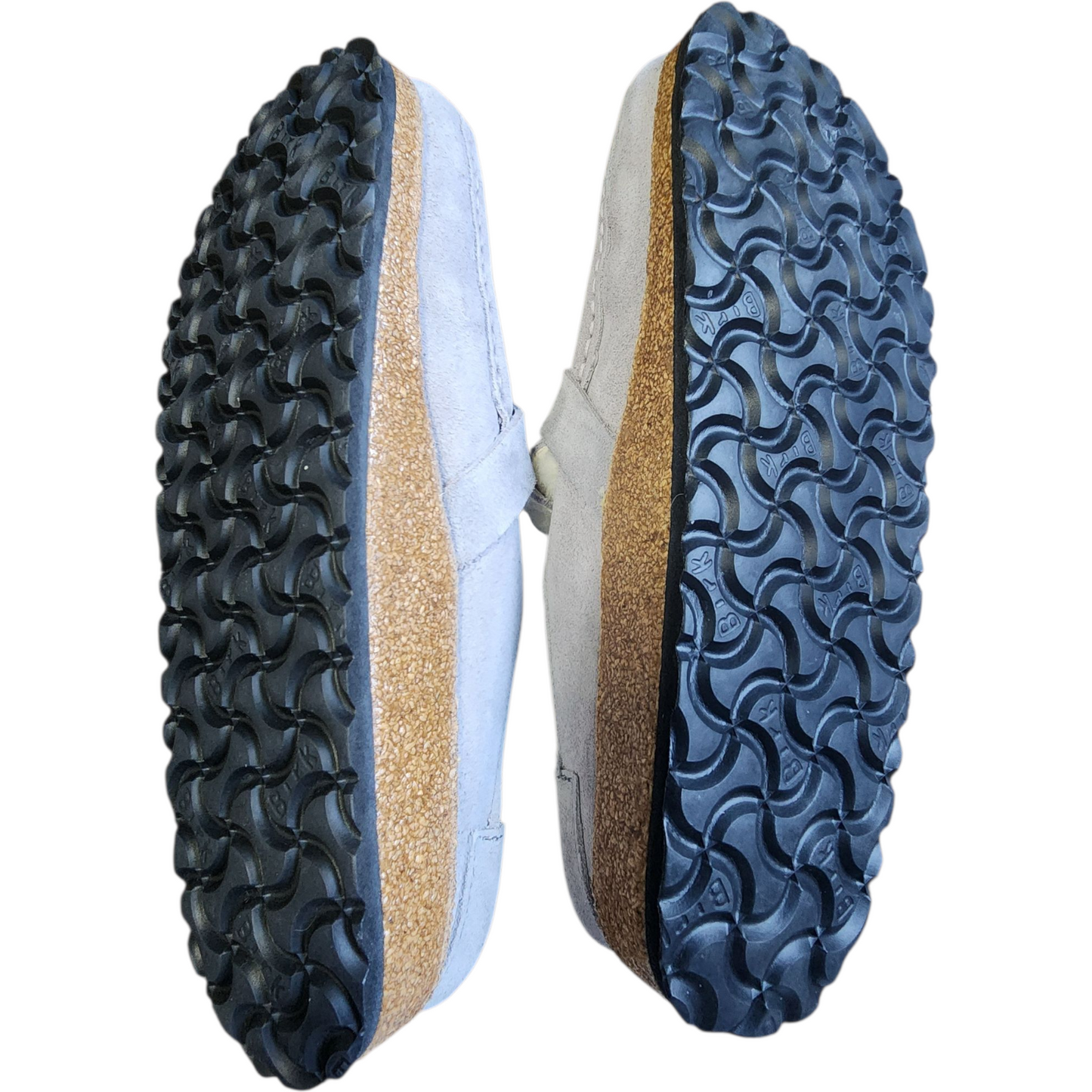 Close-up of a shoe sole with a textured pattern on a white background