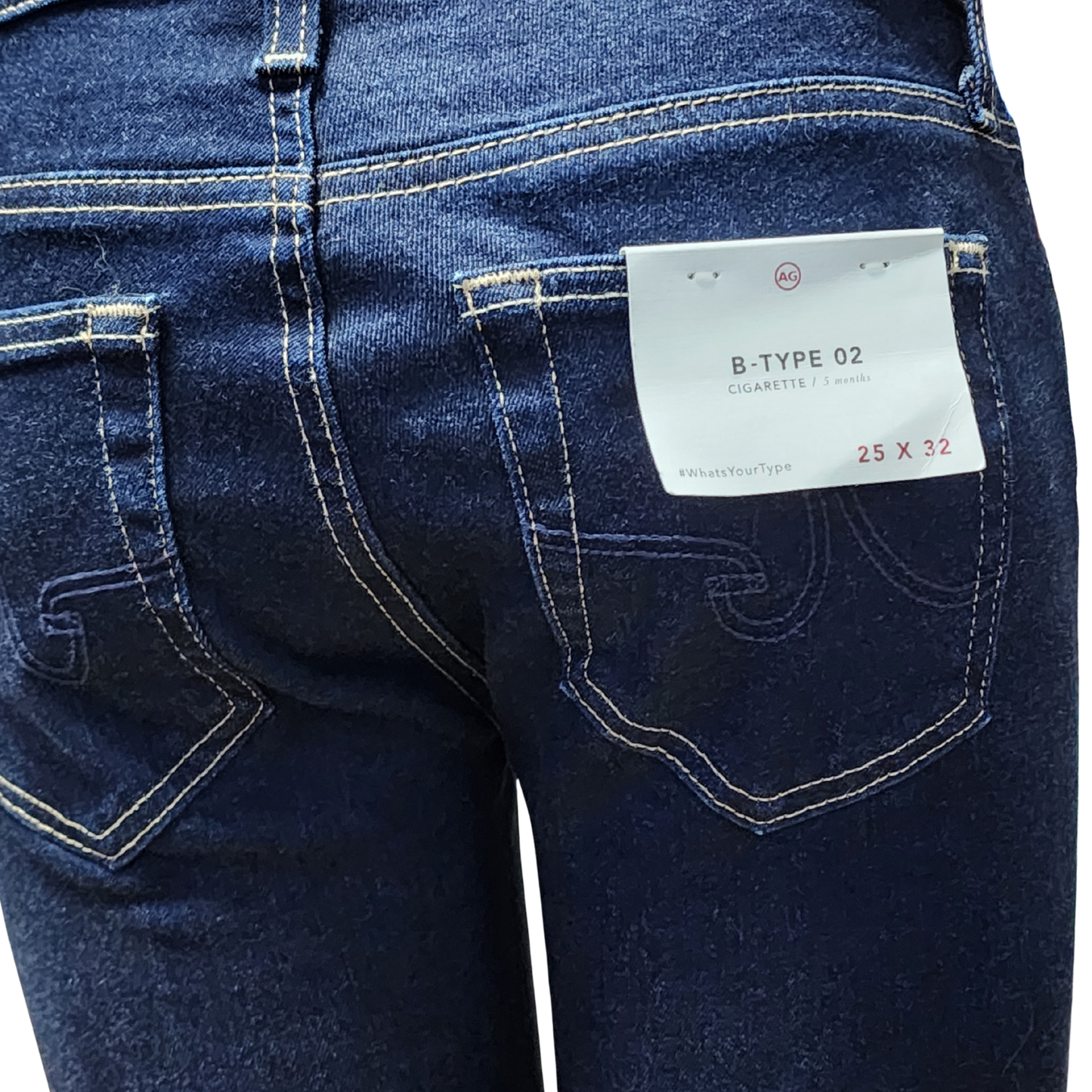 Close-up of blue jeans with a tag on the pocket