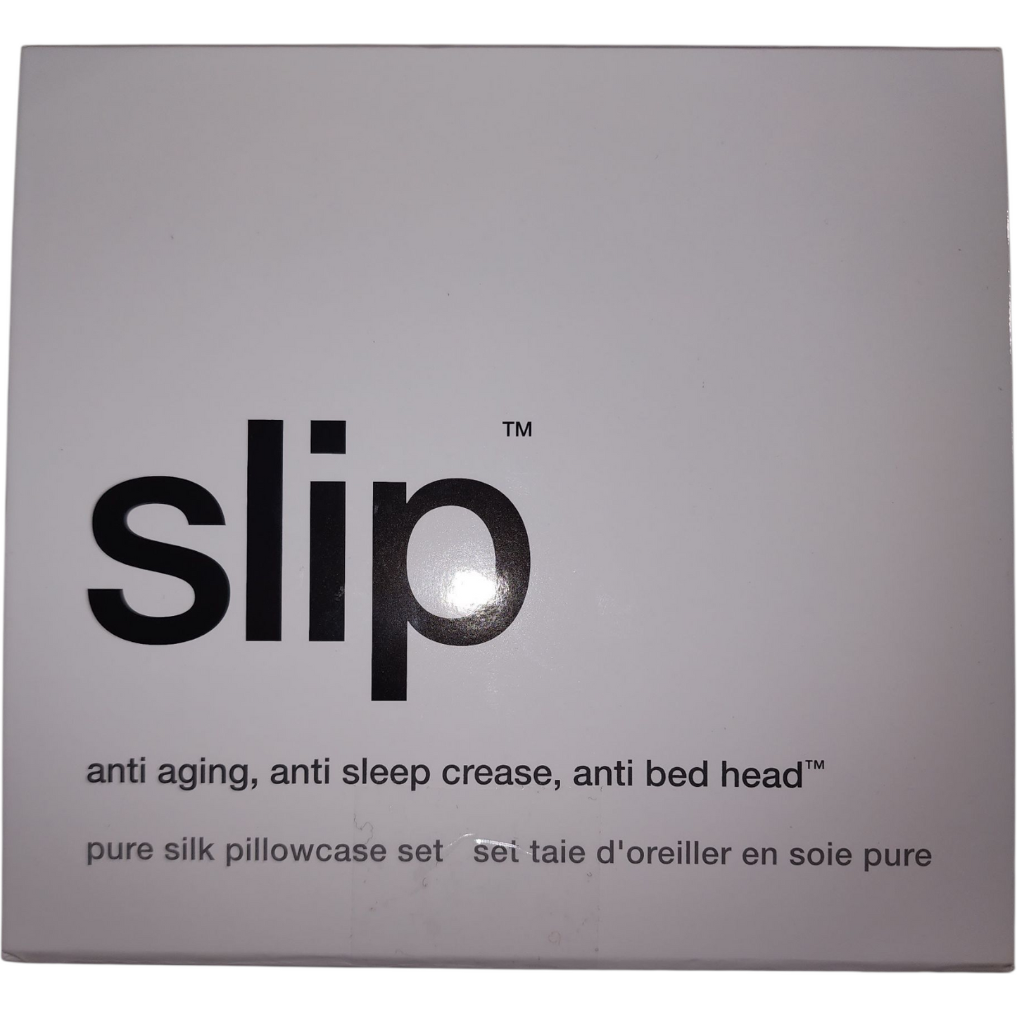 Box of slip pure silk pillowcase set with text on a gray background
