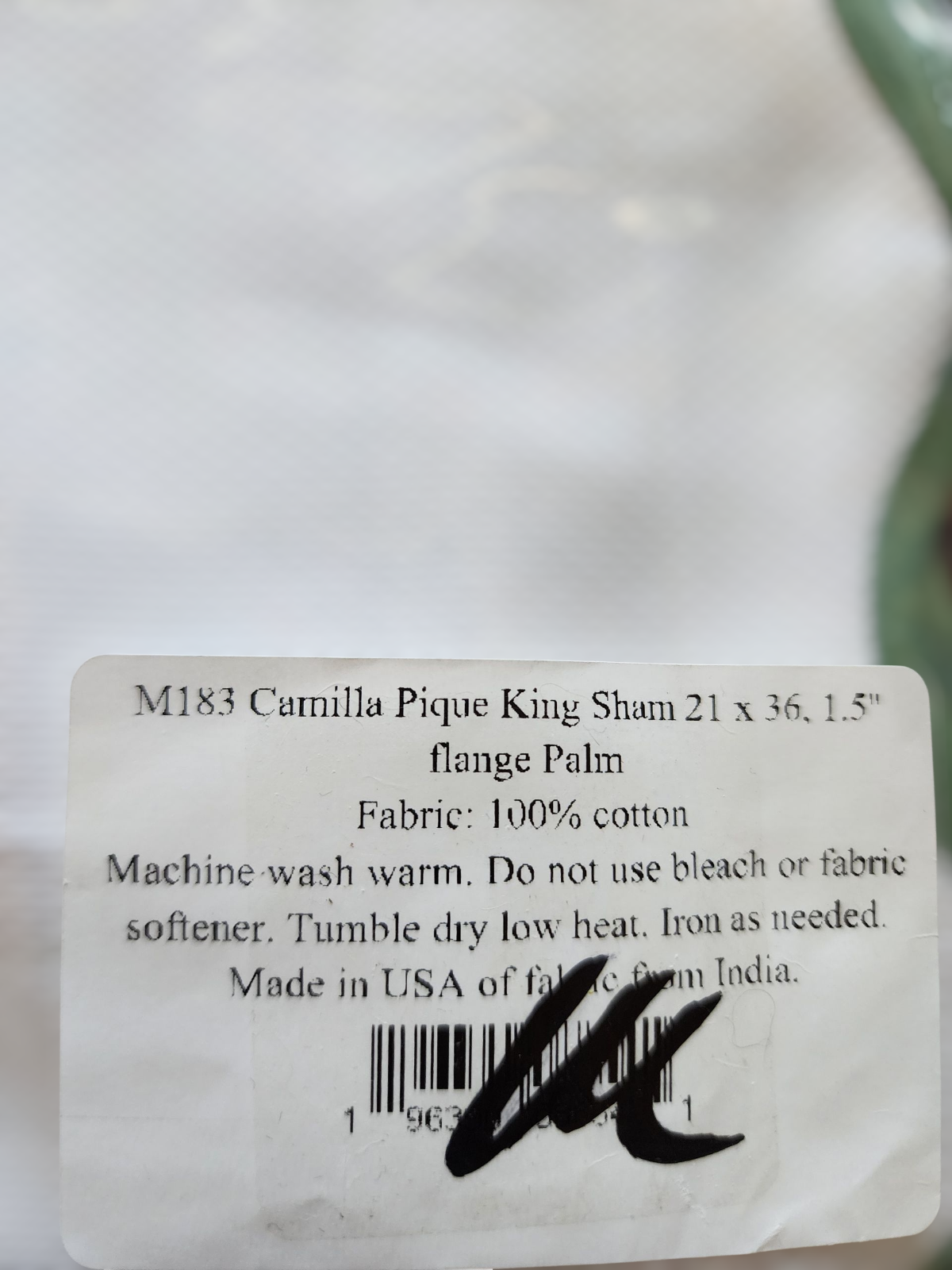 Fabric label on a white background with product details.
