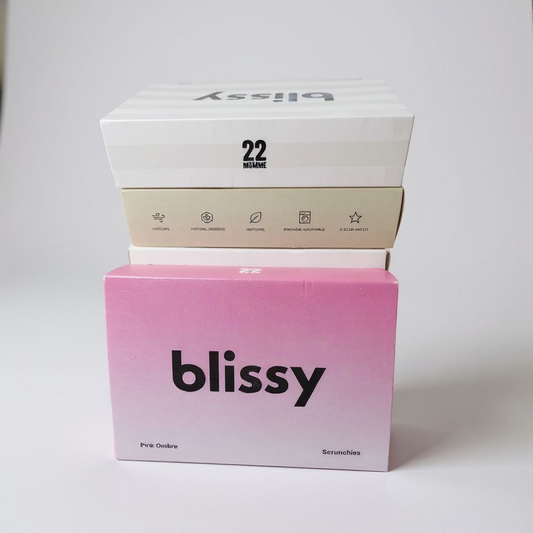 Two 'blissy' boxes stacked on a white background