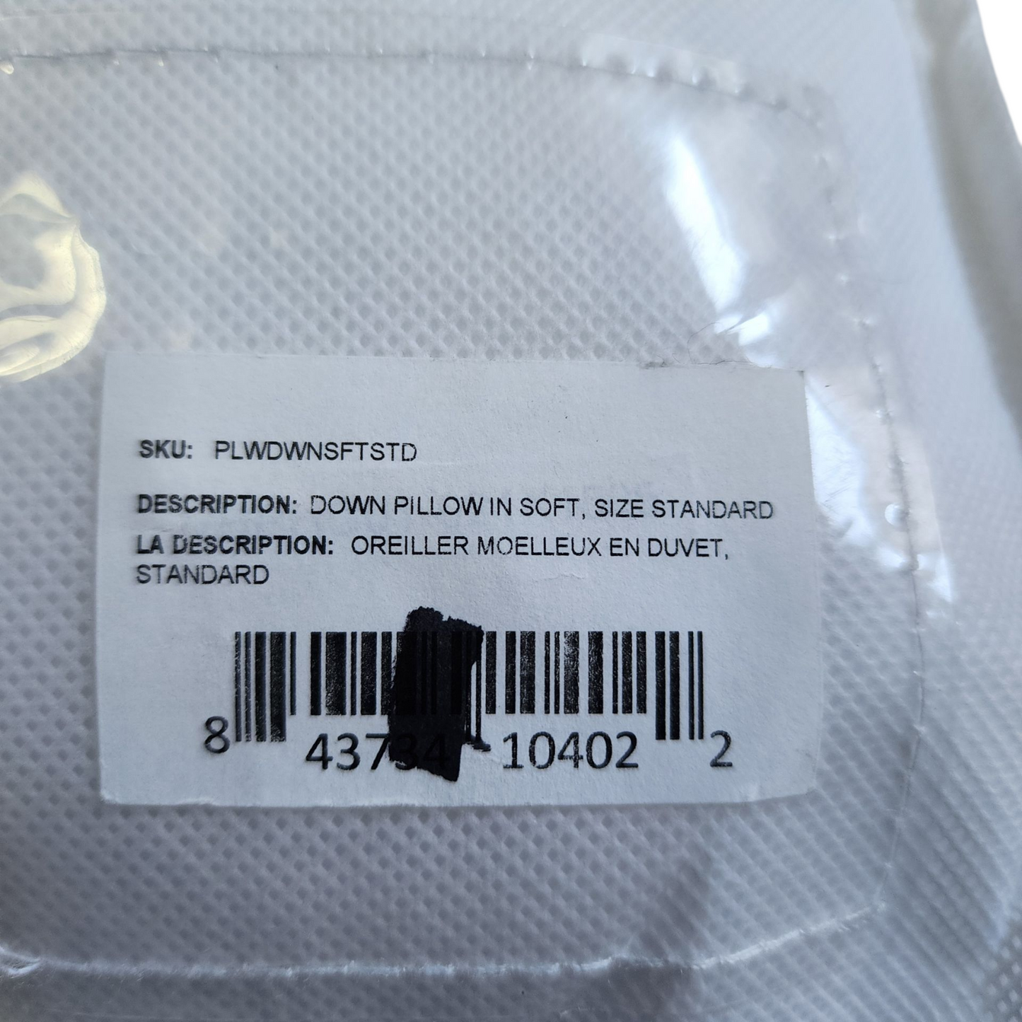 Label on a down pillow packaging with product details and barcode.