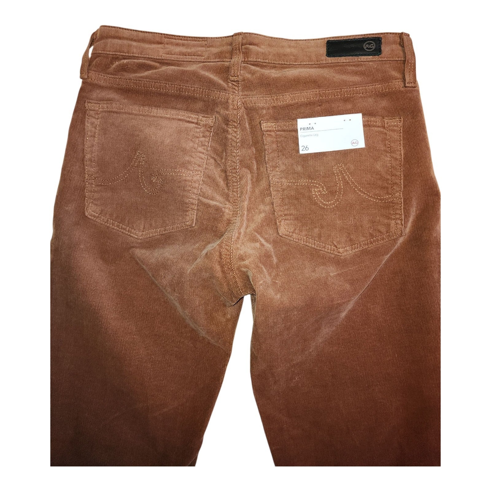 Brown corduroy pants with a visible brand label on a white background