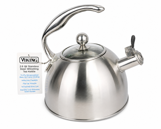 Viking stainless steel whistling tea kettle on white background.